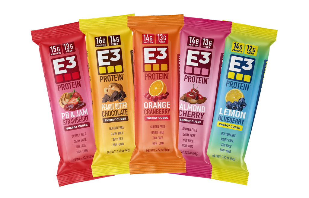 E3 Protein 5 flavor variety pack showing left to right, PB & Jam Strawberry, PB Chocolate, Orange Cranberry, Almond Cherry, and Lemon Blueberry