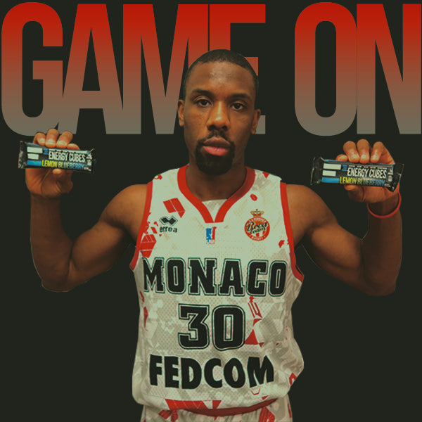 Norris Cole holding up his favorite flavor of E3 Energy Cubes (Lemon Blueberry protein bar), NBA Champion, Monaco Basketball team, Gluten-free, Soy-free, Dairy-free, All Natural, Non-gmo
